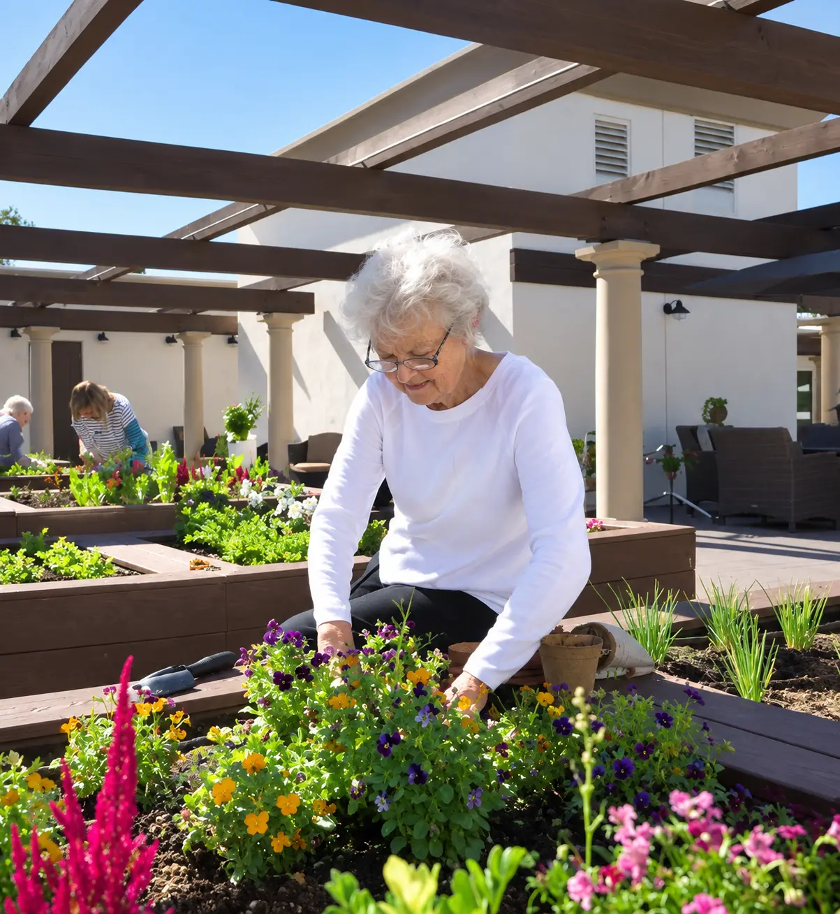 Resident enjoying the raised garden beds at Legacy Assisted Living